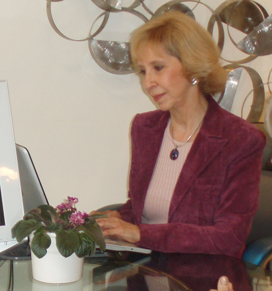 Laury Adams at her desk